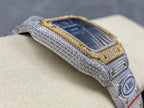 Cartier watch angled view with blue dial, gold bezel trim, gray diamond strap