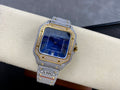 Cartier watch with blue dial, Roman numerals, jeweled bezel, gray diamond strap