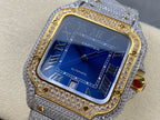 Cartier watch with blue dial and Roman numerals, gold bezel border, gray jeweled strap