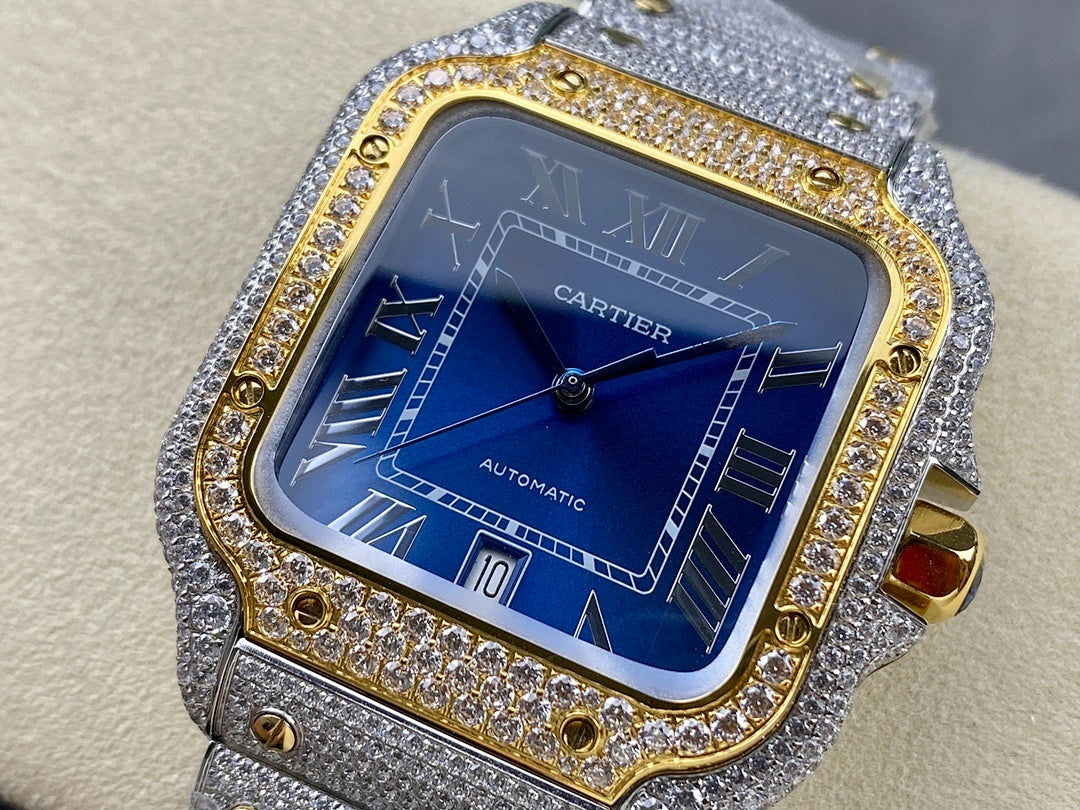 Cartier watch with blue dial and Roman numerals, gold bezel border, gray jeweled strap
