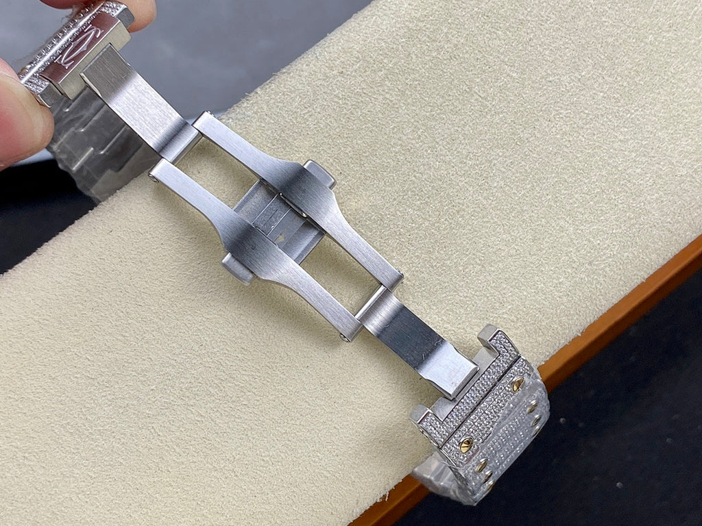 Cartier watch clasp view with gray metal bracelet links and jeweled end pieces
