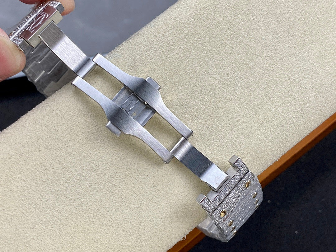 Cartier watch clasp view with gray metal bracelet links and jeweled end pieces