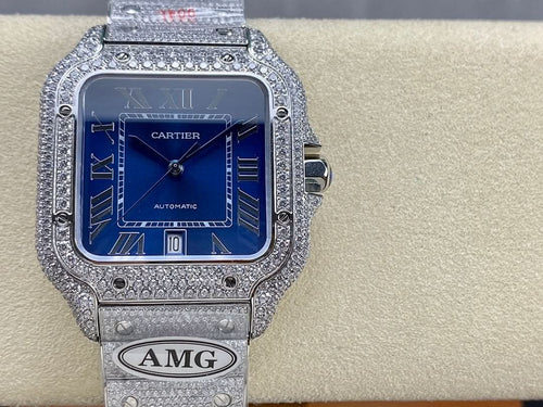 Cartier diamond watch with blue dial, Roman numerals, and silver link bracelet strap