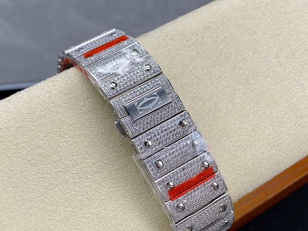 Cartier diamond watch with silver textured case, red accent bezel detail, bracelet links