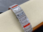 Cartier diamond watch with silver textured case, red accent bezel detail, bracelet links