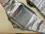 Cartier watch caseback with engraved Cartier logo on silver metal, bracelet visible