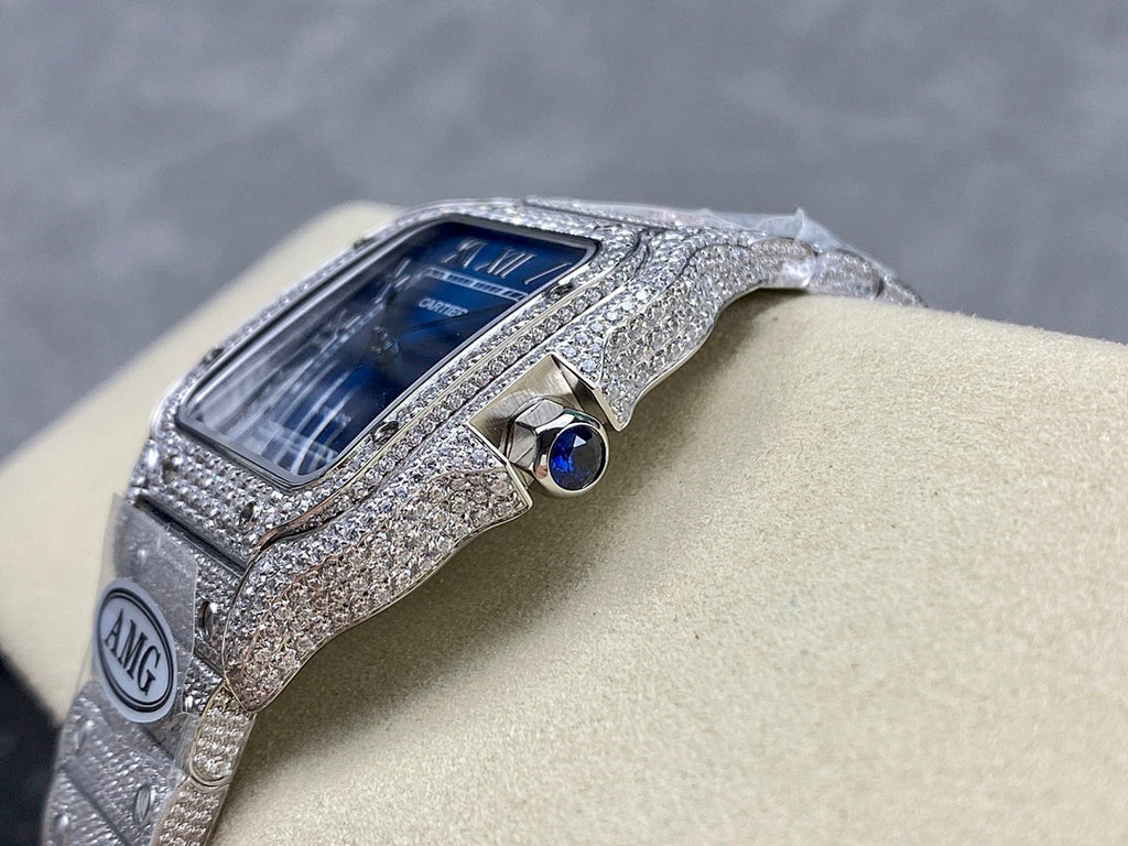 Cartier diamond watch with blue dial and silver case, blue circular detail near crown