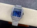 Cartier diamond watch with blue dial and silver textured bracelet, crown on right side