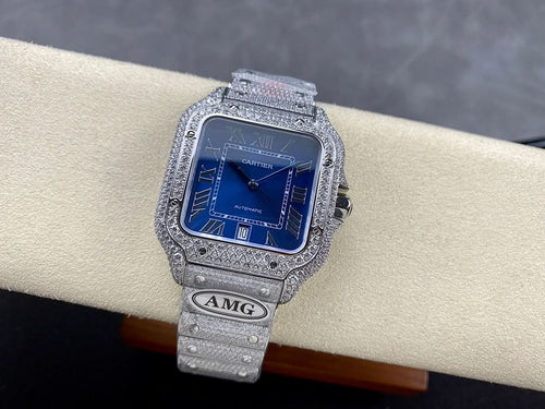 Cartier diamond watch with blue dial and silver textured bracelet, crown on right side