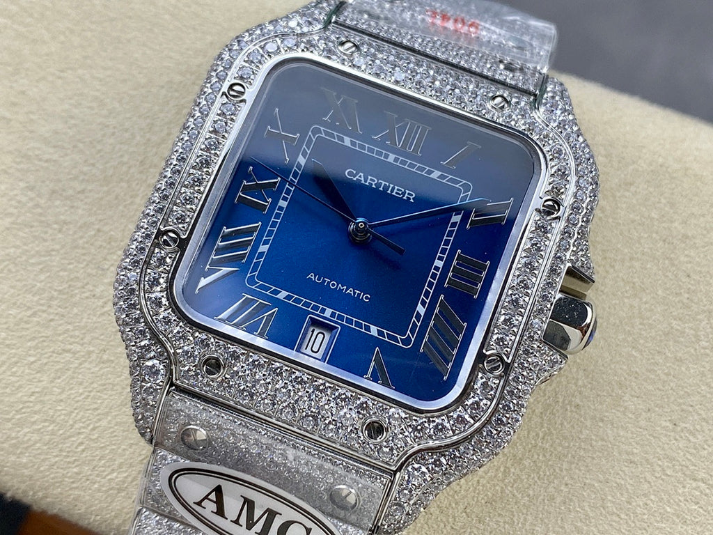 Cartier diamond watch with blue dial and Roman numerals, silver link bracelet strap