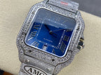 Cartier diamond watch with blue dial and Roman numerals, silver link bracelet strap