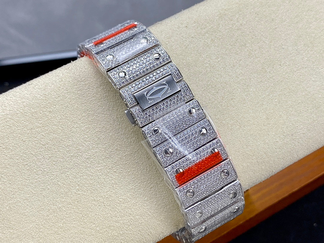 Diamond-studded Cartier watch with red accents on case and metal strap