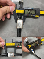 Rectangular wristwatch with black leather strap and silver-tone case, laid out for size check.