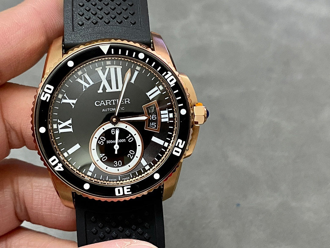 Gold-tone dive watch showing black dial, Roman numerals, and three subdial indicators