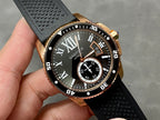 Gold-tone dive watch close-up with black dial, Roman numerals, and subdial window
