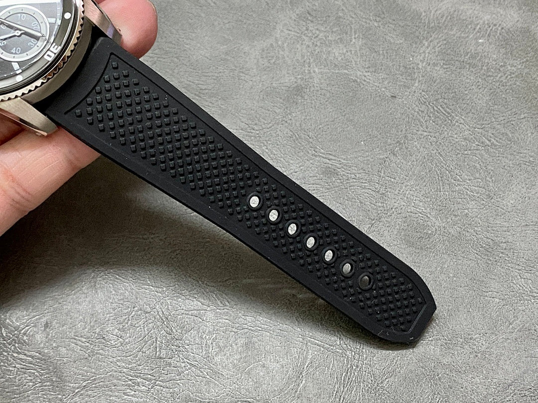 Cartier rubber watch strap with raised texture and metal buckle, black