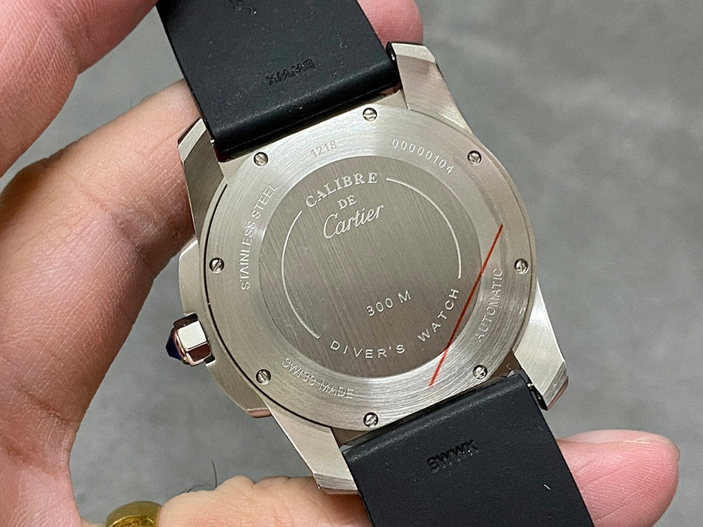 Cartier watch caseback with Diver 300M marking and black strap, stainless steel