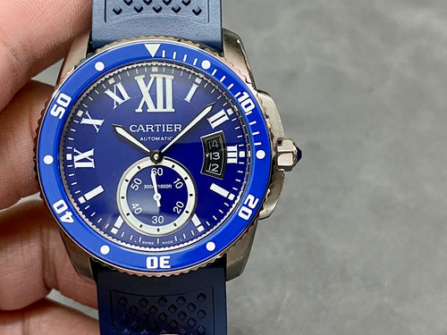 Blue dial Cartier-style watch with Roman numerals, subdial, and date window on bezel