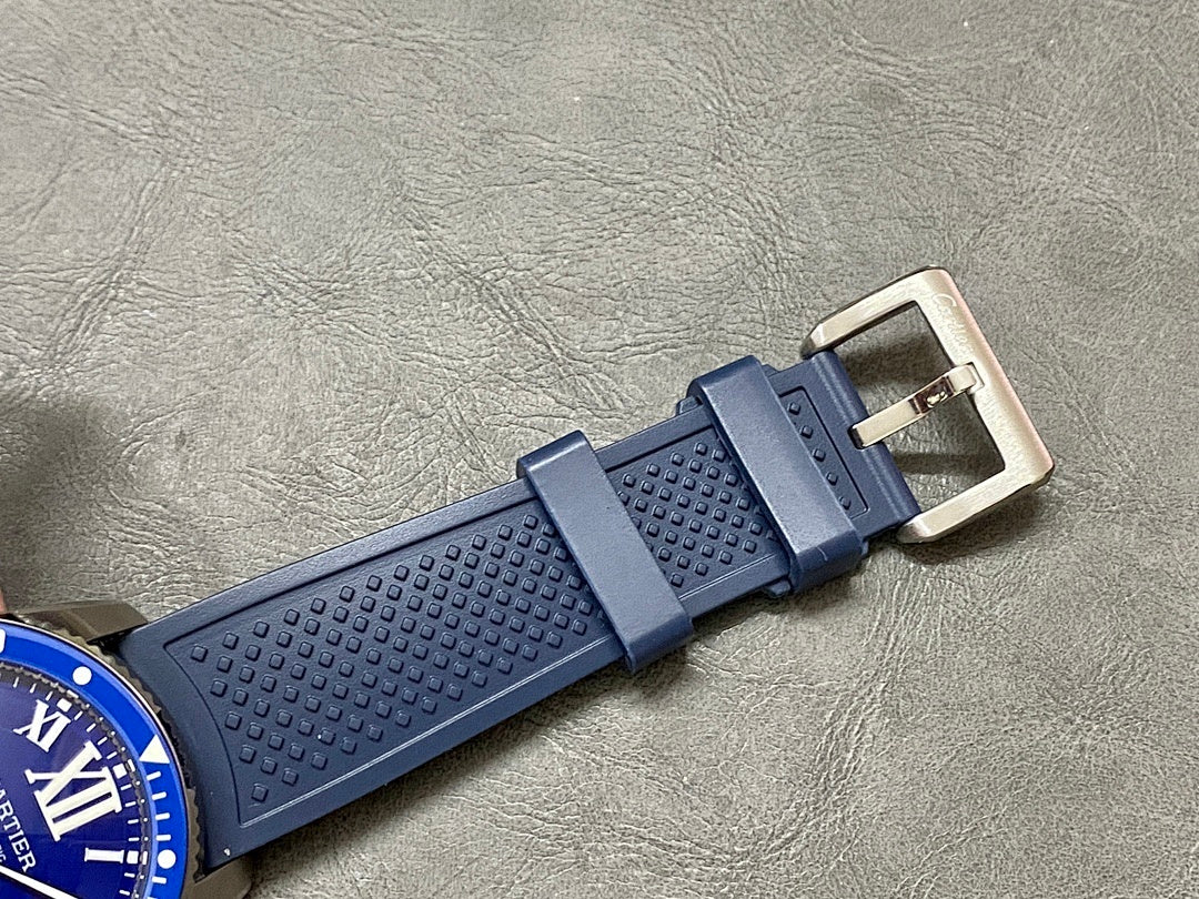 Blue silicone watch strap with textured pattern and metal buckle clasp