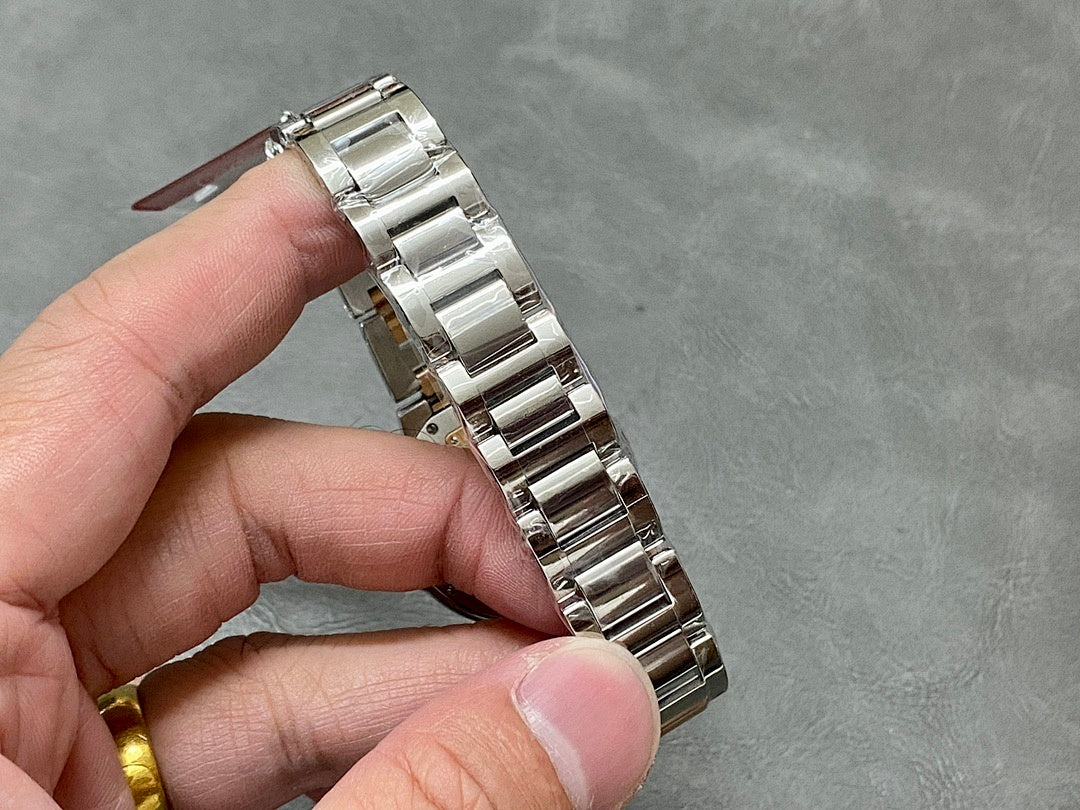 Stainless steel watch bracelet links shown from the side