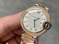 Gold and silver wristwatch with jeweled bezel and white dial, blue hands