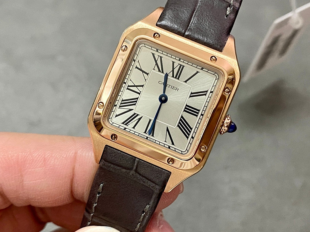 Cartier wristwatch: rose gold square case, white dial, Roman numerals, blue hands, black leather strap