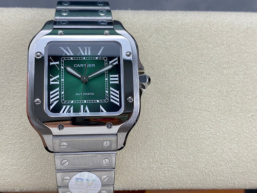 Stainless steel wristwatch with green dial, Roman numerals, and black bezel