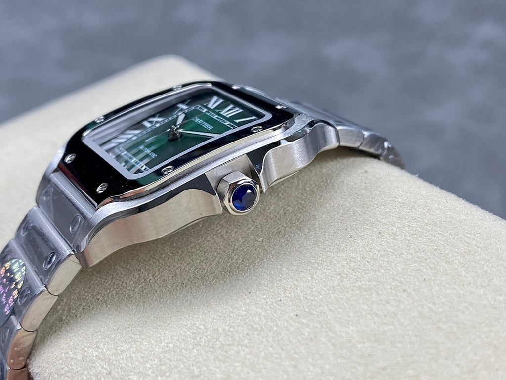 Stainless steel watch head with green dial and blue crown jewel detail