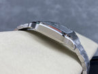 Stainless steel wristwatch in profile with crown and polished bracelet links