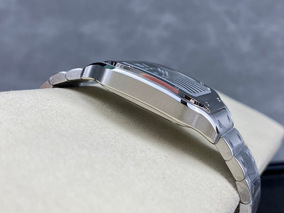 Stainless steel wristwatch in profile with crown and polished bracelet links