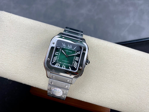 Cartier watch with green dial and stainless steel bracelet, rectangular black bezel