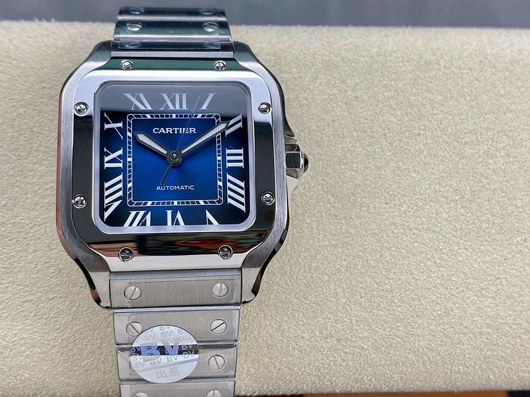 Cartier wristwatch with blue dial, Roman numerals, and steel bracelet, automatic text visible