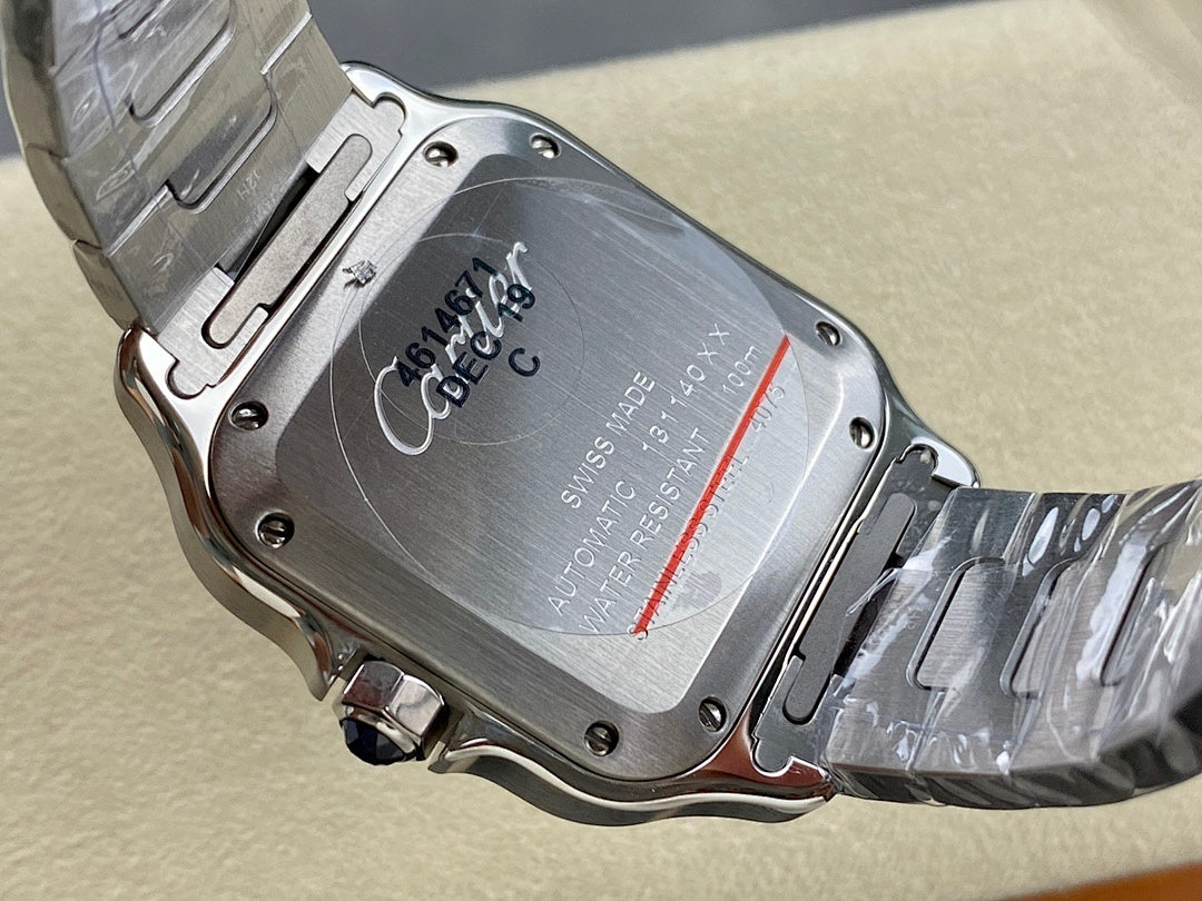 Cartier wristwatch case back with engraved text and steel bracelet links