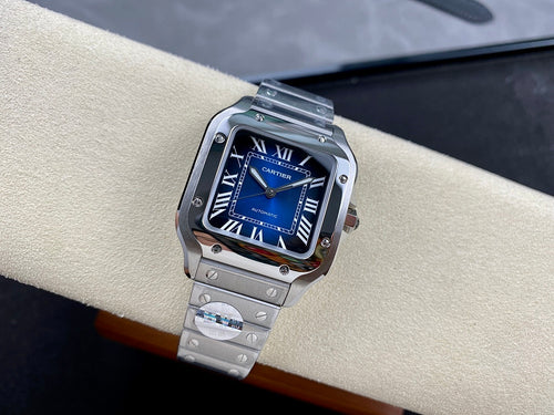 Cartier wristwatch with blue dial, Roman numerals, and steel bracelet on cushion