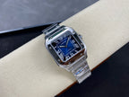 Cartier wristwatch three-quarter view with blue dial, Roman numerals, and steel bracelet