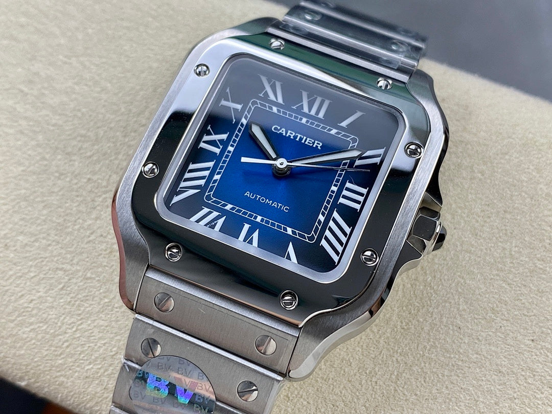 Cartier wristwatch close-up with blue dial, Roman numerals, and steel case bezel