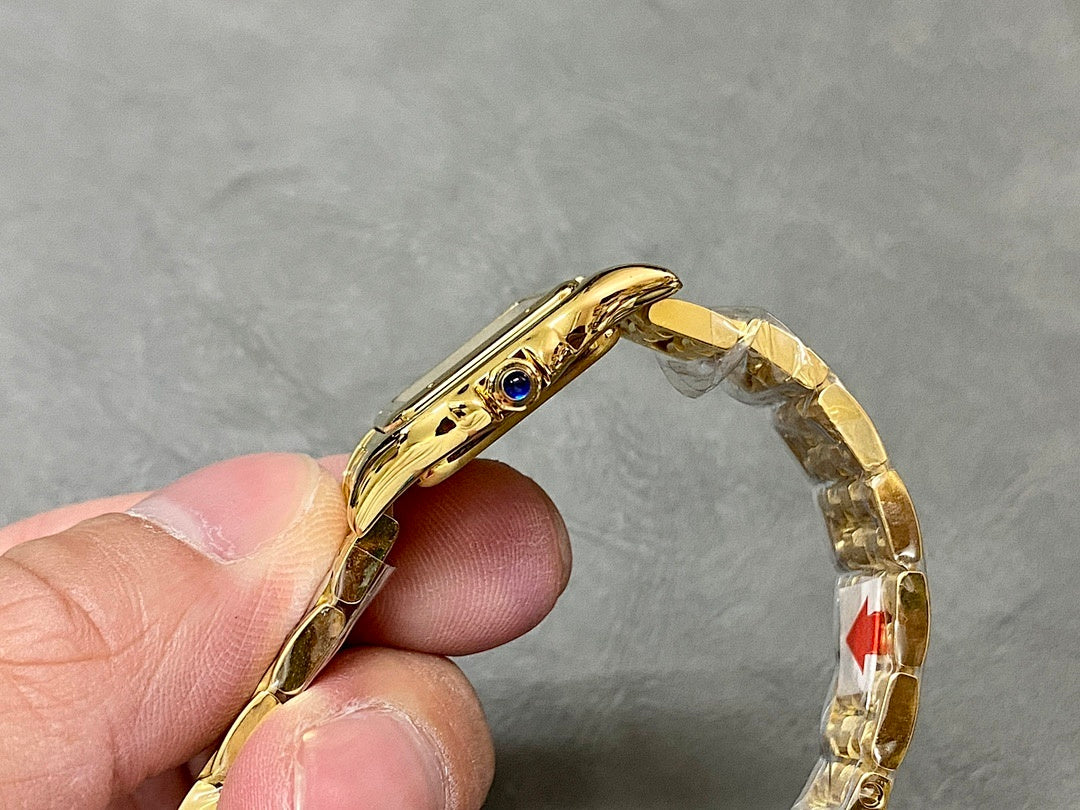 Gold-tone Cartier wristwatch angled view showing bezel and side crown