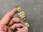 Gold-tone Cartier square wristwatch with Roman numeral dial and metal link band