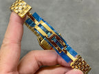 Cartier watch side profile with gold bracelet links and square case