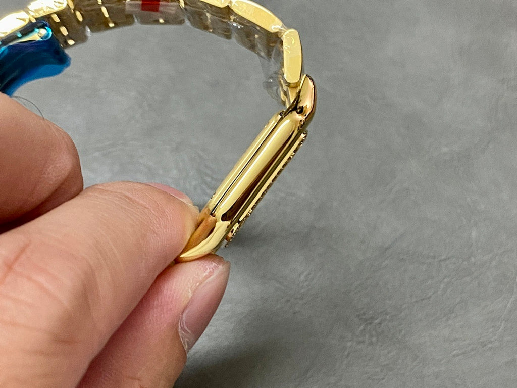 Cartier watch angled side view showing gold case curve and bracelet links