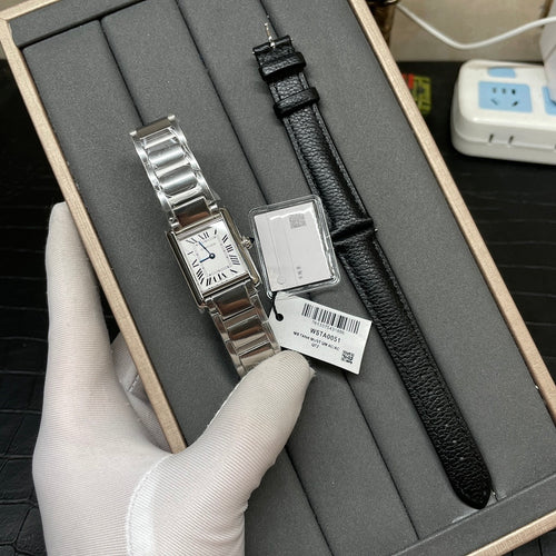 Cartier watch with silver-tone bracelet and black leather strap, shown in box