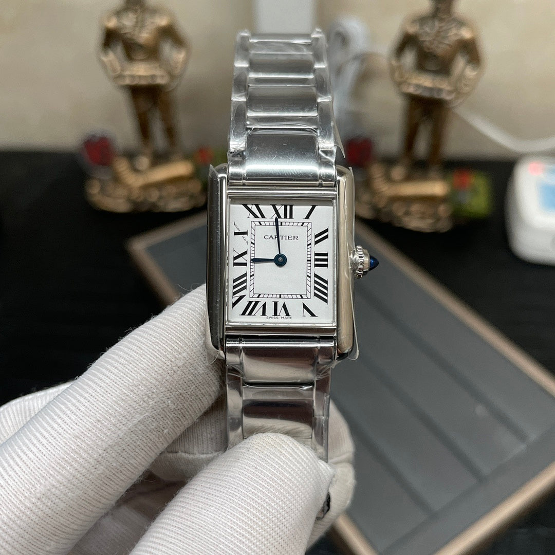 Cartier watch front view with silver-tone bracelet and white Roman numeral dial