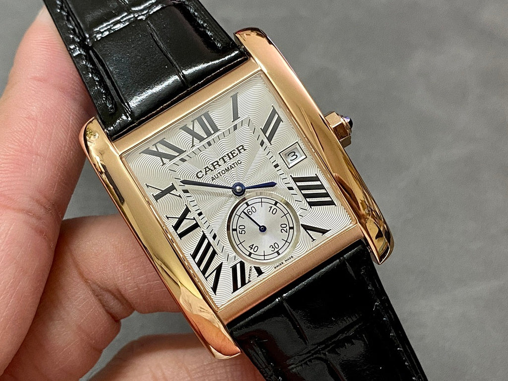 Cartier watch close-up: rose-gold case, white dial with Roman numerals, black strap