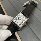 Cartier wristwatch angled view with silver case, white dial, Roman numerals, and black leather strap.