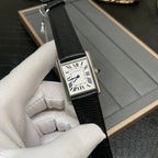 Cartier square wristwatch front view with white dial, Roman numerals, and black leather strap.