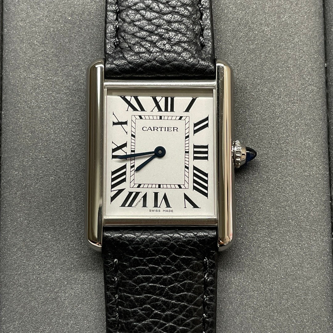 Square Cartier wristwatch with silver case, black leather strap, white dial and Roman numerals.