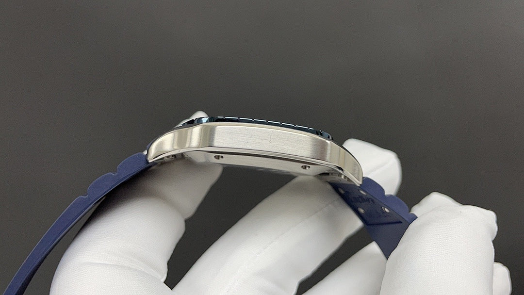 Cartier watch top view with silver bezel and blue leather strap