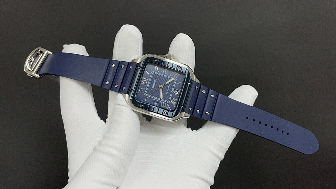 Cartier watch on blue strap with silver case and blue dial, hands visible