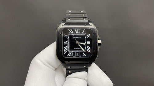 Cartier black dial automatic wristwatch with Roman numerals and steel bracelet