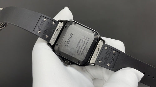 Cartier black strap wristwatch with open caseback and engraved markings